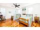 Charming bedroom features hardwood floors, twin beds, and lots of natural light at 1302 Middle St, Sullivans Island, SC 29482