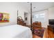 Primary bedroom features four poster bed, hardwood floors, area rug and natural light at 1302 Middle St, Sullivans Island, SC 29482