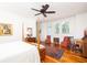 Light-filled bedroom showcasing hardwood floors, white walls, and a cozy rug, blending comfort and elegance at 1302 Middle St, Sullivans Island, SC 29482