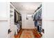 Spacious walk-in closet with custom shelves, storage and hardwood floors at 1302 Middle St, Sullivans Island, SC 29482