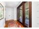 Bright entryway featuring wood floors and large sliding doors to the outdoor patio at 1302 Middle St, Sullivans Island, SC 29482