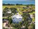 Home exterior with a three-car garage, surrounded by trees, near a historic site at 1302 Middle St, Sullivans Island, SC 29482
