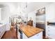 Bright kitchen with white cabinets, stainless appliances, wood island countertop. Open to dining and living at 1302 Middle St, Sullivans Island, SC 29482