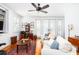 Bright living room with white sofas, a ceiling fan, and views of the outdoors at 1302 Middle St, Sullivans Island, SC 29482