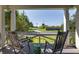 Relaxing porch view with rocking chairs overlooking a beautifully landscaped lawn at 1302 Middle St, Sullivans Island, SC 29482