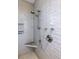 Bathroom walk-in shower features gray tile, seating, and shower head at 1302 Middle St, Sullivans Island, SC 29482