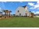 Expansive backyard with lush lawn and manicured landscaping provides ample space for outdoor activities at 1530 Homecoming Blvd, Ravenel, SC 29470