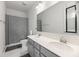 Bright bathroom featuring a double vanity and shower with curtain at 1530 Homecoming Blvd, Ravenel, SC 29470