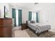 Cozy bedroom with a full-sized bed, stylish decor, and good natural light at 1530 Homecoming Blvd, Ravenel, SC 29470
