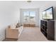 Spare room with comfortable couch, television, and storage space at 1530 Homecoming Blvd, Ravenel, SC 29470