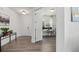 Bright foyer with wood floors and white trim leads to a well-lit office and other living areas at 1530 Homecoming Blvd, Ravenel, SC 29470