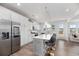 Modern kitchen boasts stainless appliances, large island with seating, and ample counter space at 1530 Homecoming Blvd, Ravenel, SC 29470