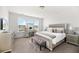Well-lit main bedroom with decorative accents, including a vanity and dresser at 1530 Homecoming Blvd, Ravenel, SC 29470