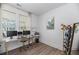 Bright home office with dual monitors, comfortable seating, and natural light for a productive workspace at 1530 Homecoming Blvd, Ravenel, SC 29470