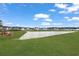 Scenic pond view surrounded by lush green lawns and community homes at 1530 Homecoming Blvd, Ravenel, SC 29470