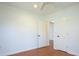 Clean, bright bedroom with hardwood floors, white walls, and two doors at 1637 Tatum St, Charleston, SC 29412