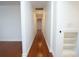 Long hallway with hardwood floors and white walls, with a closet on the right at 1637 Tatum St, Charleston, SC 29412