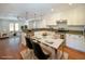 Open kitchen with granite countertops, stainless steel appliances, white cabinets, and an adjacent dining area at 1637 Tatum St, Charleston, SC 29412
