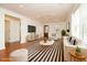 Inviting living room featuring modern furniture, hardwood floors, a ceiling fan, and a large window for natural light at 1637 Tatum St, Charleston, SC 29412