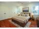 Cozy main bedroom with hardwood floors, soft rug, and a king-size bed, with natural light streaming in at 1637 Tatum St, Charleston, SC 29412