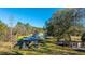 Aerial shot showcases a property with large lot, shed, carport and home with light colored siding at 165 Infinity Dr, Dorchester, SC 29437