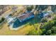The home has a wooden deck, ample parking space, and mature trees in the surrounding landscape at 165 Infinity Dr, Dorchester, SC 29437