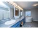 Well-lit bathroom has a double sink vanity, large mirror, and separate shower and tub at 165 Infinity Dr, Dorchester, SC 29437