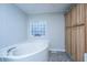 Relaxing bathroom featuring a large soaking tub and modern fixtures at 165 Infinity Dr, Dorchester, SC 29437