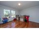 Bright bedroom with hardwood floors, natural light, and a unique loft-style bed frame at 165 Infinity Dr, Dorchester, SC 29437