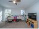 Bedroom featuring carpet, natural light, ceiling fan and entertainment center at 165 Infinity Dr, Dorchester, SC 29437