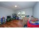 Cozy bedroom featuring hardwood floors, natural light, and a playful atmosphere at 165 Infinity Dr, Dorchester, SC 29437