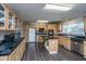 Well-equipped kitchen features black countertops, an island, and abundant cabinet space at 165 Infinity Dr, Dorchester, SC 29437