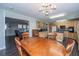 Open kitchen and dining area boasts wood cabinets and seamless flow to the living space at 165 Infinity Dr, Dorchester, SC 29437