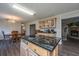 Kitchen island with granite countertop; view into dining area at 165 Infinity Dr, Dorchester, SC 29437