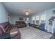 Spacious living room with comfortable seating, large windows, and stylish decor at 165 Infinity Dr, Dorchester, SC 29437