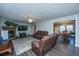 Inviting living room with stone fireplace, comfortable seating, and adjacent dining area at 165 Infinity Dr, Dorchester, SC 29437