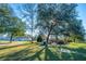 Large shaded yard with picnic table, shed, and trees, perfect for outdoor activities at 165 Infinity Dr, Dorchester, SC 29437