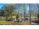 Spacious yard with multiple storage sheds, and outbuildings offer ample storage capacity at 165 Infinity Dr, Dorchester, SC 29437
