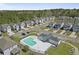Aerial view showcases the community pool and surrounding neighborhood with well-maintained streets and various home styles at 1800 Poplar Grove Pl, Summerville, SC 29483