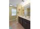 Bright bathroom features a double vanity with modern fixtures and tile flooring and a separate toilet area for added privacy at 1800 Poplar Grove Pl, Summerville, SC 29483