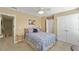 Bedroom with a ceiling fan features an ensuite bathroom and a double-door closet providing generous storage space at 1800 Poplar Grove Pl, Summerville, SC 29483