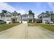 Attractive two-story home with well-maintained lawn and driveway, nestled in a quiet neighborhood setting at 1800 Poplar Grove Pl, Summerville, SC 29483
