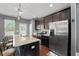 Modern kitchen featuring stainless steel appliances, granite countertops, and an island with seating at 1800 Poplar Grove Pl, Summerville, SC 29483
