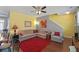Spacious living room with a large sectional sofa, hardwood floors, and a striking red rug at 1800 Poplar Grove Pl, Summerville, SC 29483