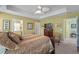 Main bedroom with tray ceiling and ceiling fan includes an en suite bathroom and dressing area at 1800 Poplar Grove Pl, Summerville, SC 29483