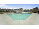 Community pool surrounded by lounge chairs and neighborhood houses offering a refreshing oasis for relaxation and social gatherings at 1800 Poplar Grove Pl, Summerville, SC 29483