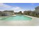 Community swimming pool with clear water and surrounding buildings, perfect for summer enjoyment at 1800 Poplar Grove Pl, Summerville, SC 29483