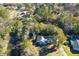 Aerial view of home on large lot, with mature trees, and water access at 1810 Laura Creek Rd, Charleston, SC 29412