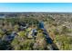 Aerial view of a home on a waterway, surrounded by trees and lush greenery at 1810 Laura Creek Rd, Charleston, SC 29412