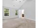 Bright, spacious main bedroom with neutral carpet, abundant natural light, and an ensuite bathroom at 1810 Laura Creek Rd, Charleston, SC 29412